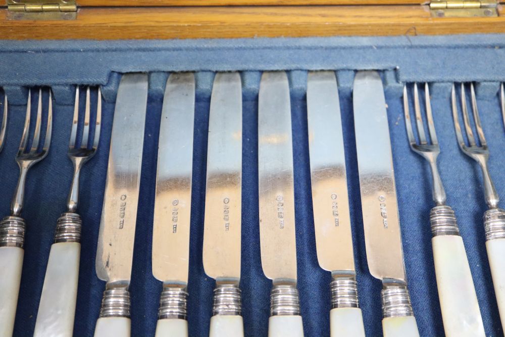 A set of ten William IV mother of pearl handles dessert knives, Atkin & Oxley, Sheffield, 1836 and a set of later similar forks